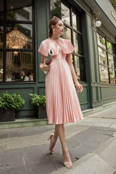 Sleeveless pleated midi silk dress with structured cape and cinched waist